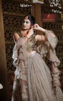 CHOLI CUT EMBELLISHED BLOUSE WITH RUFFLED SKIRT