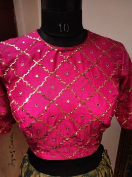 Bottle green lehenga with hot pink blouse and bandhani dupatta