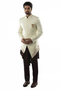 Cream Asymmetrical Hand Embroidered Achkan paired with a Brown Draped Kurta & Cotton Silk Pant Pajama