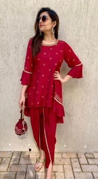 Maroon badla tunic with side panels and tulip dhoti with matching Potli