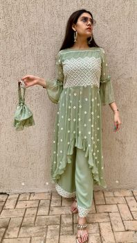 Green chikankari long top with a high low hem with pants and matching Potli