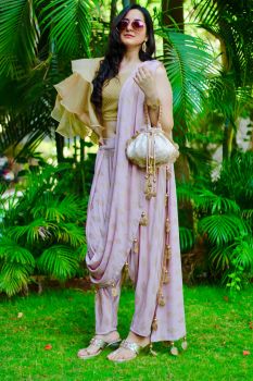 Pink block printed Lycra dhoti saree & a one shouldered backless blouse and matching Potli