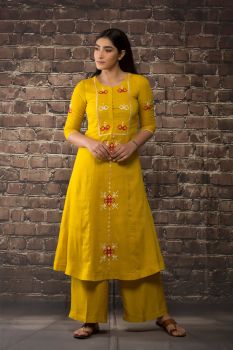 A mustard kurta paired with matching pants.