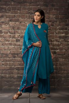 Teel blue linen georgette kurta with matching pants and dupatta.