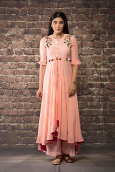 Old rose pink linen silk dress kurta paired with matching pants.