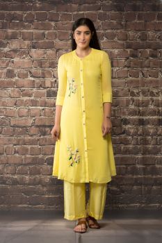 yellow linen georgette kurta paired with matching pants.