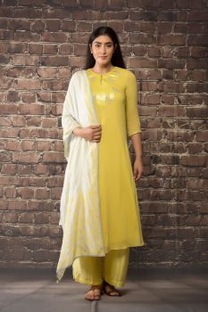 yellow linen georgette kurta paired with matching pants and dupatta.