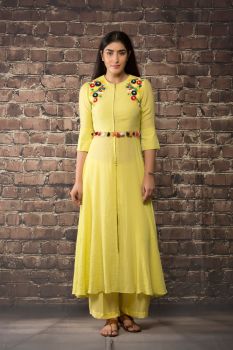 yellow linen silk dress kurta paired with matching pants.