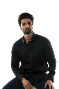 A Black Shirt With Minimal Embroidery And Metal Buttons.
