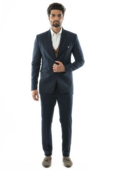 A 3 Piece Suit With A Navy One Button Blazer Paired With a Tan Colored Waistcoat. Comes With Narrow Fitted Trousers.