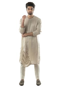 An Oyester Grey Kurta with a Asymmetric Drape Detailing Paired With Narrow Fitted Pant Pajama.