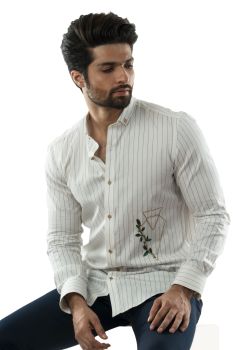 A White Pinstriped Shirt With Geometric Floral Embroidery Motif On One Panel and Stylised Cuff Detailing.