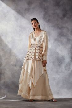 Asymmetric pants and sequin peplum